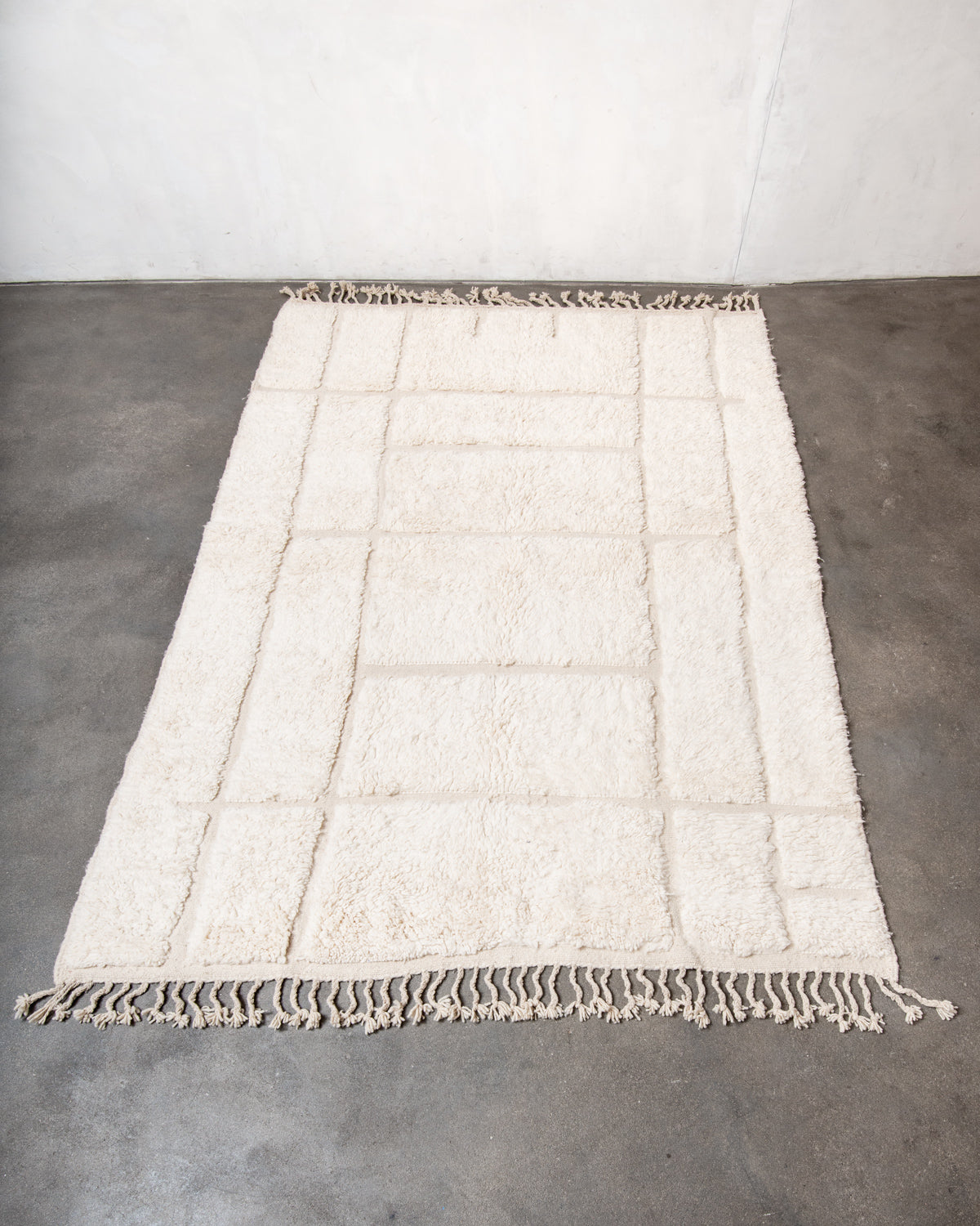 Modern, designer, handcrafted Berber rug from Morocco. Beniourain carpet with minimalist design, natural wool pile and a fluffy texture.